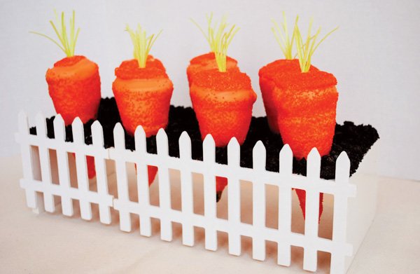 carrot shaped cupcakes made with sugar cones and sparkles for easter with oreo dirt