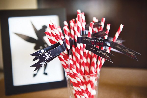 neverland inspired first birthday party striped red pirate straws with hoho flags and tinkerbell