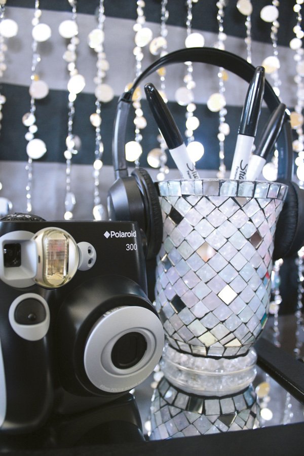 teen party photo booth with a polaroid camera