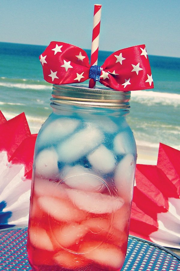 Red white & blue drinks in mason jars with star bow-tie topper