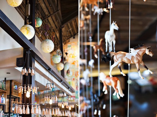 Cucina Enoteca interior decor with hanging globes and toy horses
