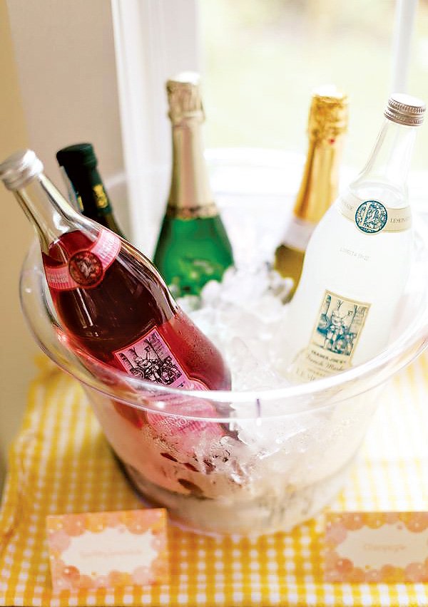 sparkling drinks in a bucket of ice at a brunch birthday party