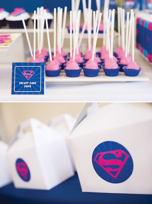 pink and blue superman cake pops and party favor boxes