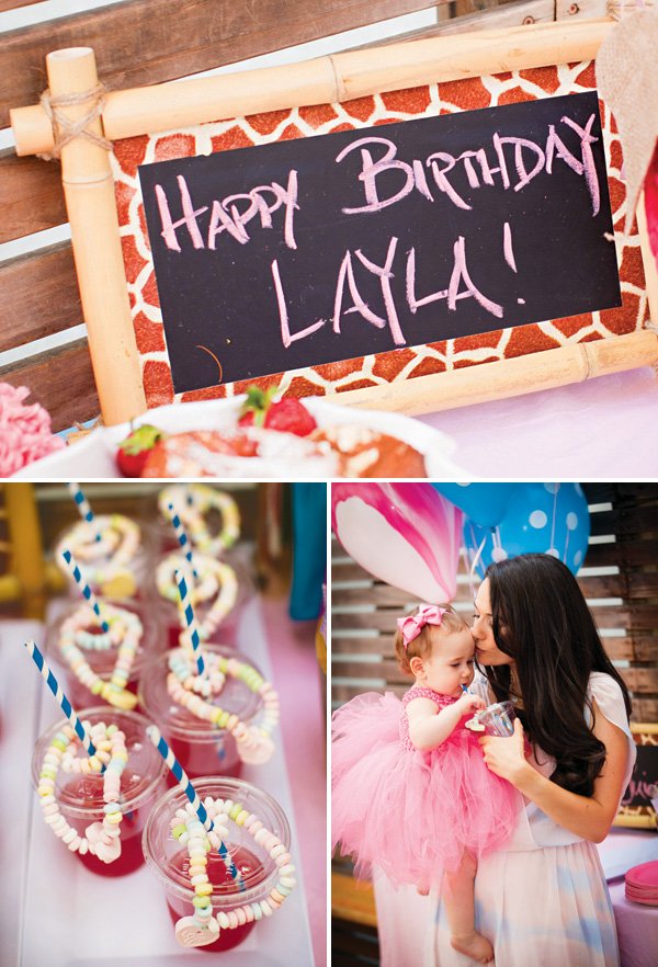pink first birthday party with chalkboard welcome sign and pink drinks