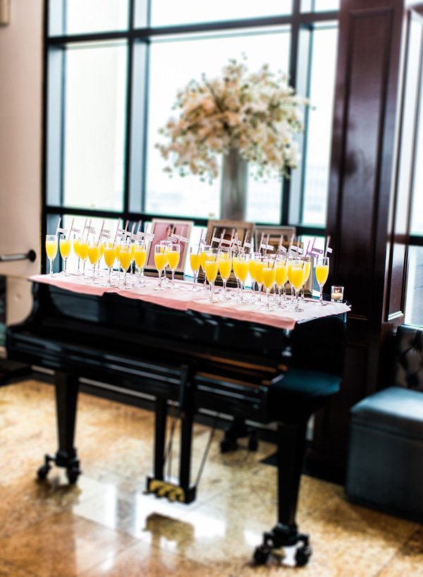 party flag place cards on a piano welcome table
