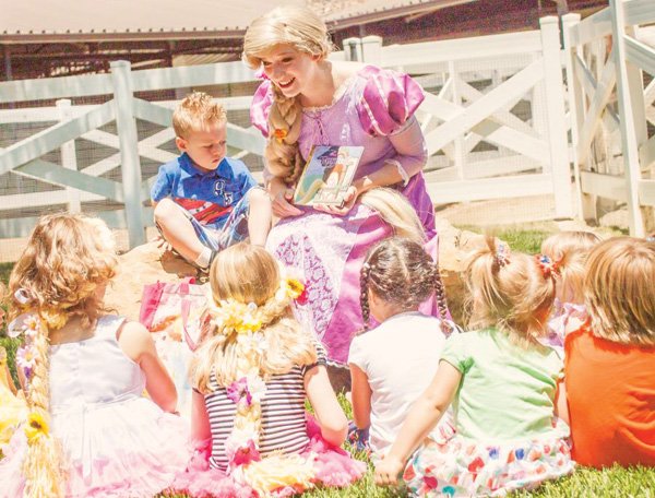 rapunzel reading a story at a birthday party