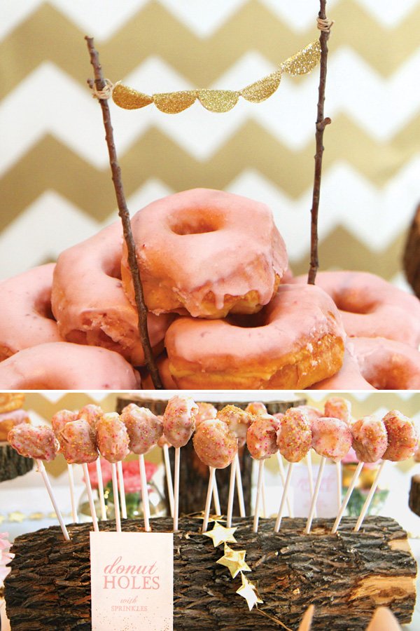 rustic wooden dessert stands and pink doughnuts