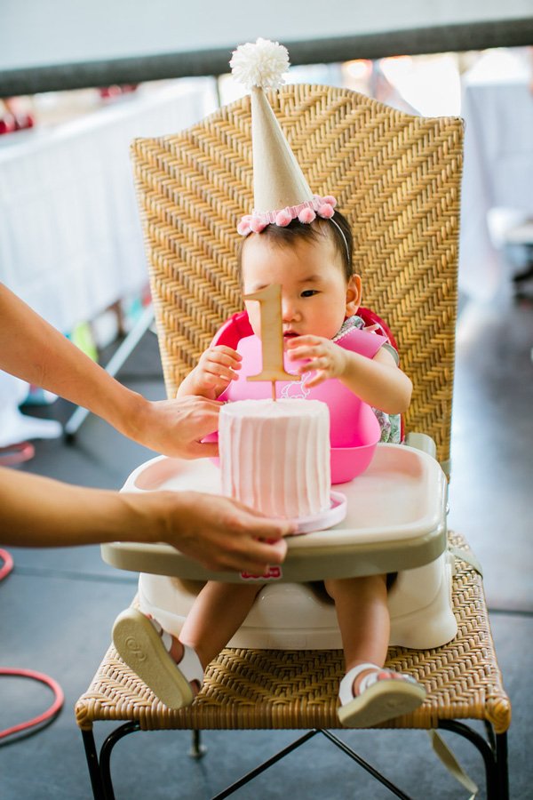 pink smash cake and wooden 1 topper