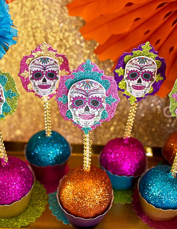 sugar skull topped candy apples