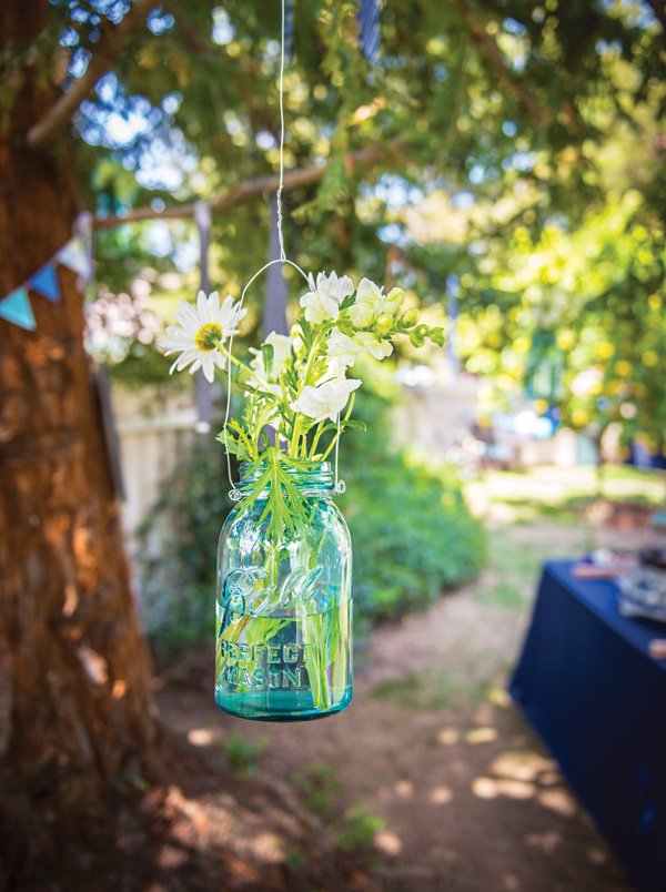 hanging blue mason jar with flowers
