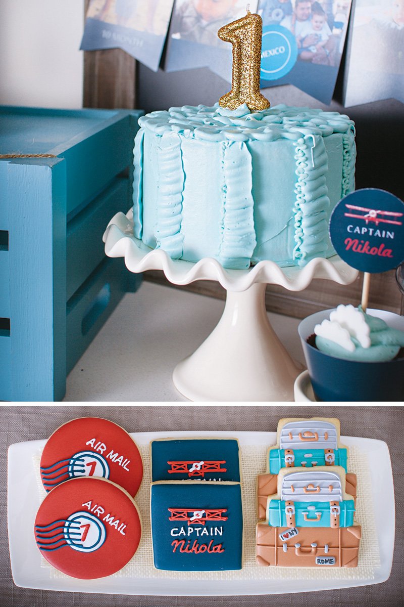 plane themed party cookies and first birthday candle